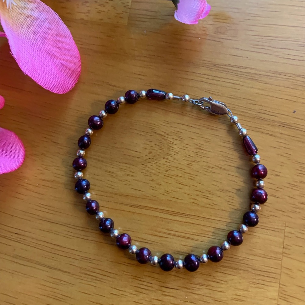 Vintage bracelet with maroon glass beads and gold-tone spacers, 7 inches